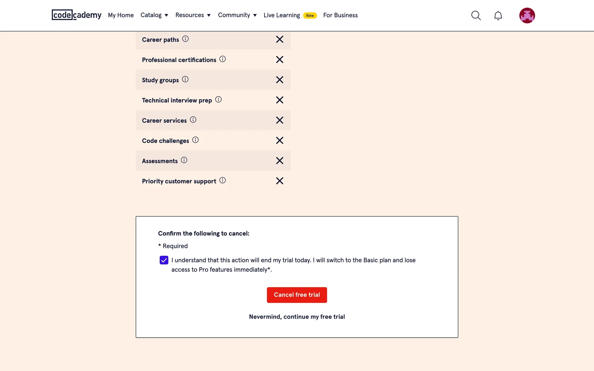 Codecademy confirmation box with the "I understand…" checkbox now ticked, the red "Cancel free trial" button active, and a "Nevermind, continue my free trial" link below it