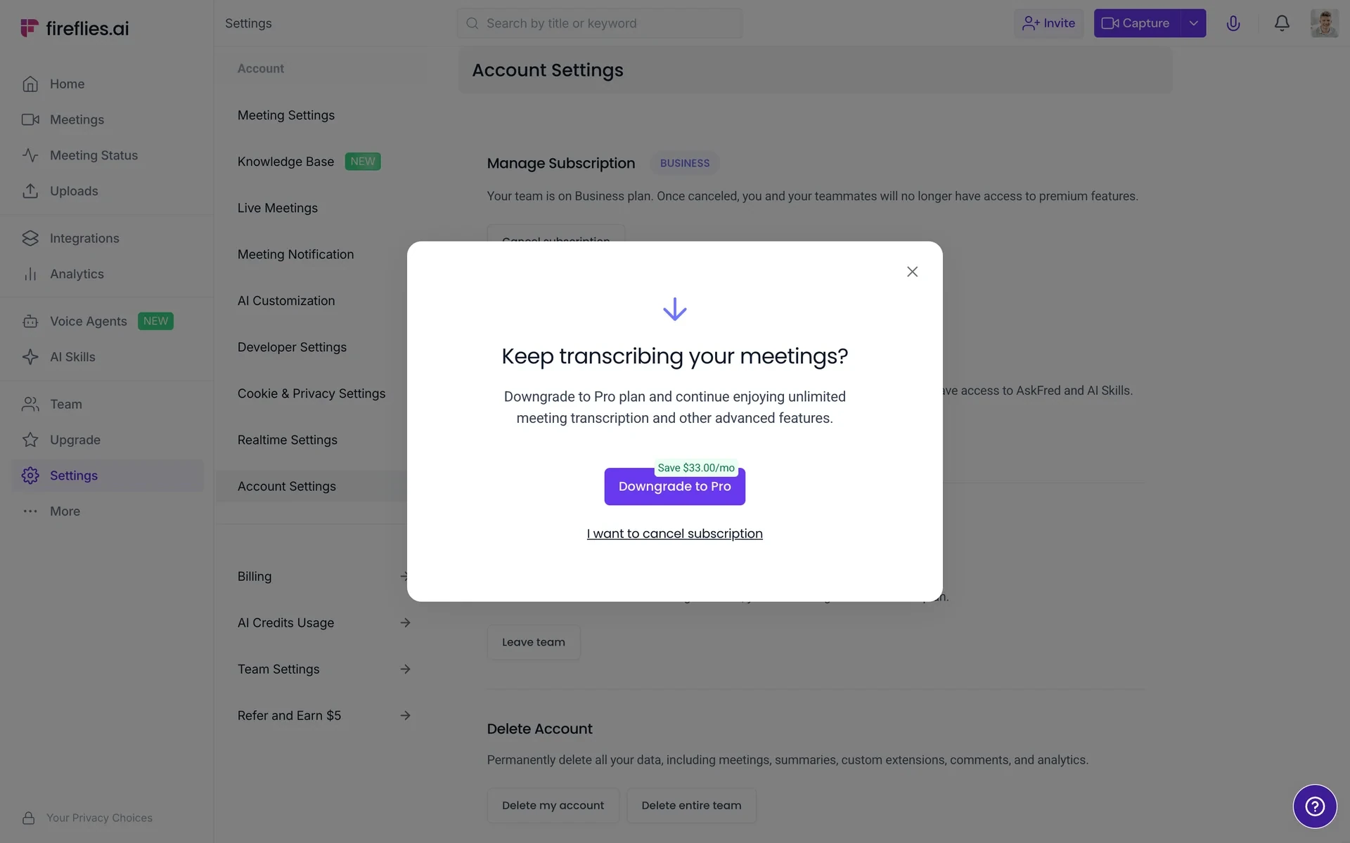 Keep transcribing your meetings? modal offering a Downgrade to Pro button labelled Save $33.00/mo above an underlined I want to cancel subscription link