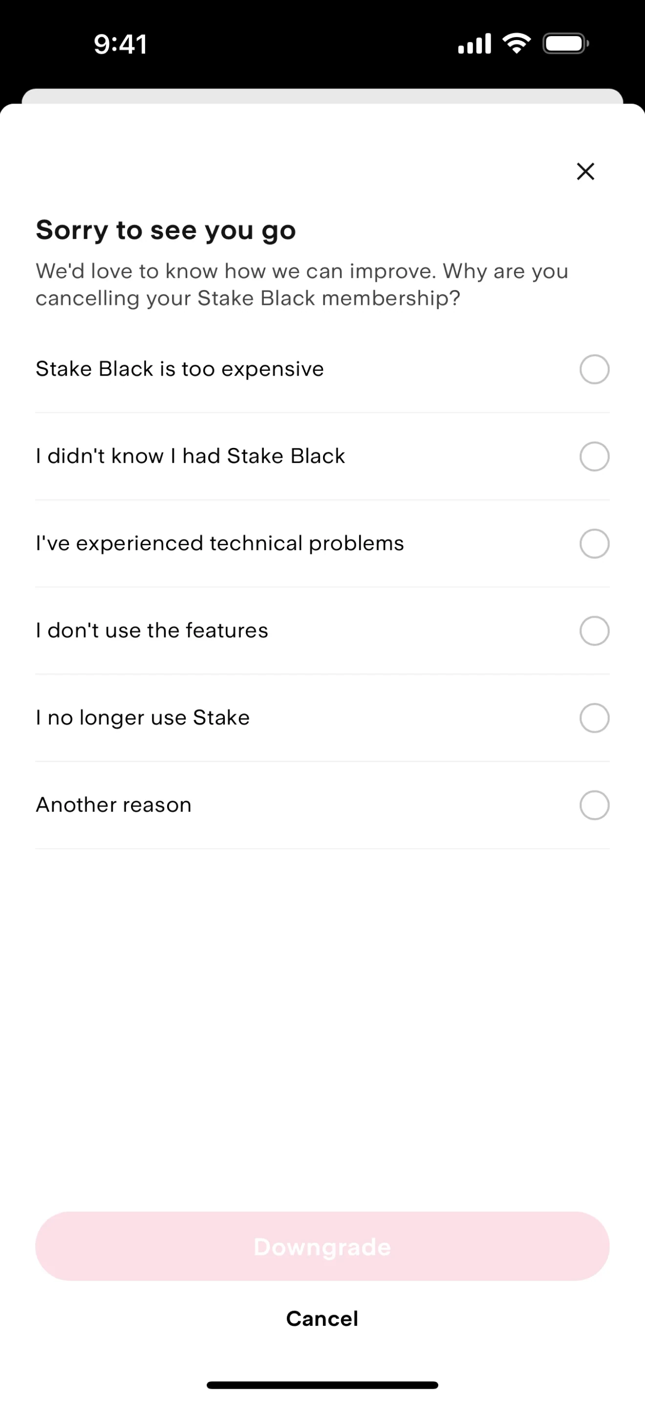 Stake Sorry to see you go survey listing six cancellation reasons with empty radio buttons, a faded pink Downgrade button, and a Cancel text link below