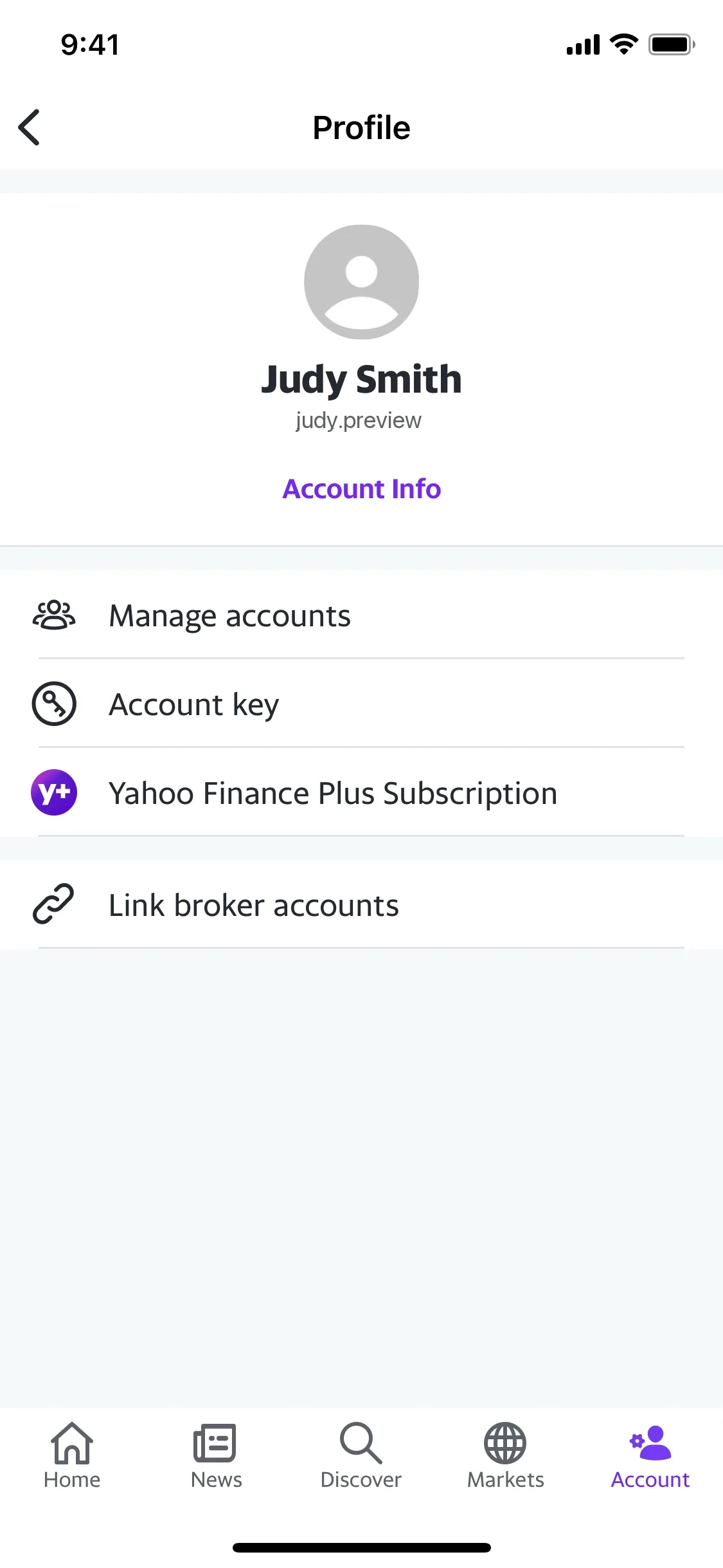 Yahoo Finance iOS Profile screen for Judy Smith showing Account Info and a Yahoo Finance Plus Subscription row with a purple Y+ icon, above the Account tab in the bottom nav